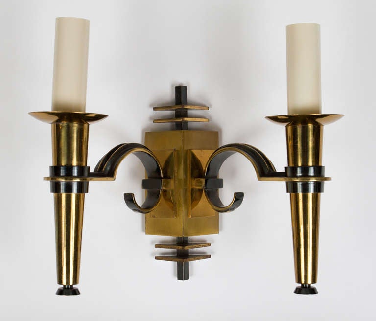 Stylish pair of lacquered and patinated cast bronze and gunmetal Art Deco sconces.