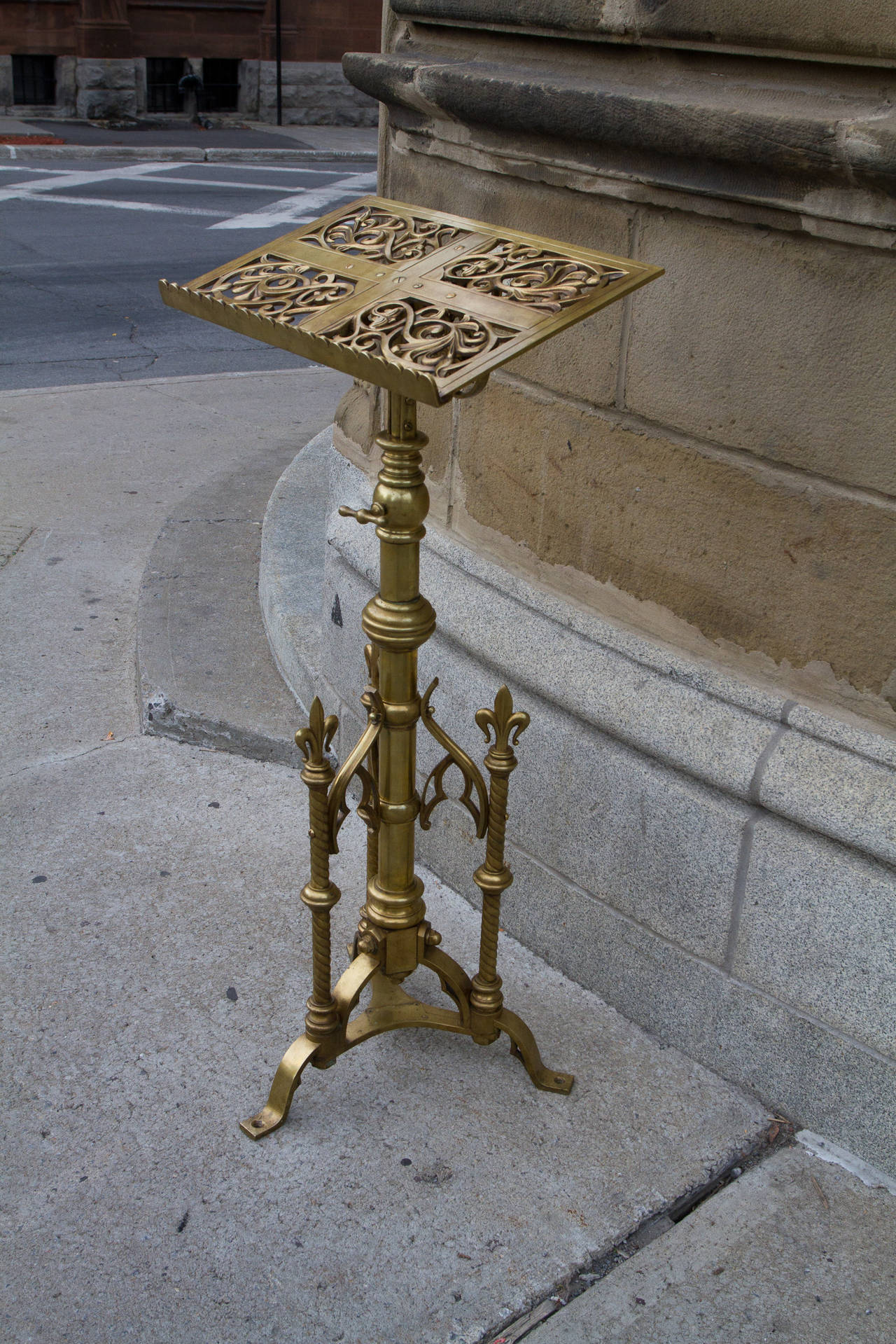 Highly original and unique solid cast brass neogothic style lectern, could also be used as a music stand. Decorated with fleur de lys, flowers and gothic attributes. By Keith and Fitzsimons. Signed on base: Keith and Fitzsimons. 

Keith and