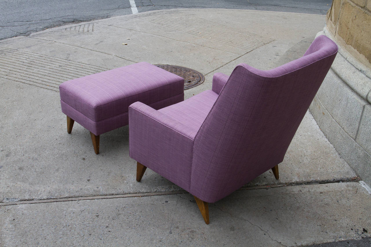 Attractive Paul McCobb wingback armchair with matching ottoman. Newly upholstered in fine mauve linen.