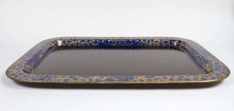 Interesting black japanned rectangular tray with unusual cobalt blue and gilt decoration.