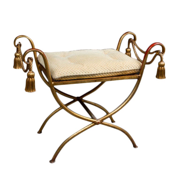 Italian gilt metal vanity stool with rope twist and tassel decorations.