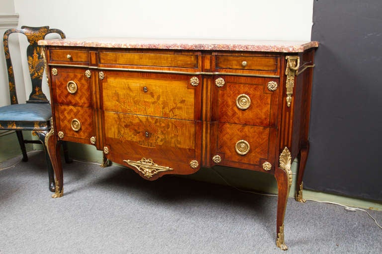 Fine transitional Louis XV - Louis XVI style, three drawer commode d'apparat. Extensively inlaid with floral decoration and geometric marquetry, fitted with fine gilt bronze mounts and original brocatel marble top.