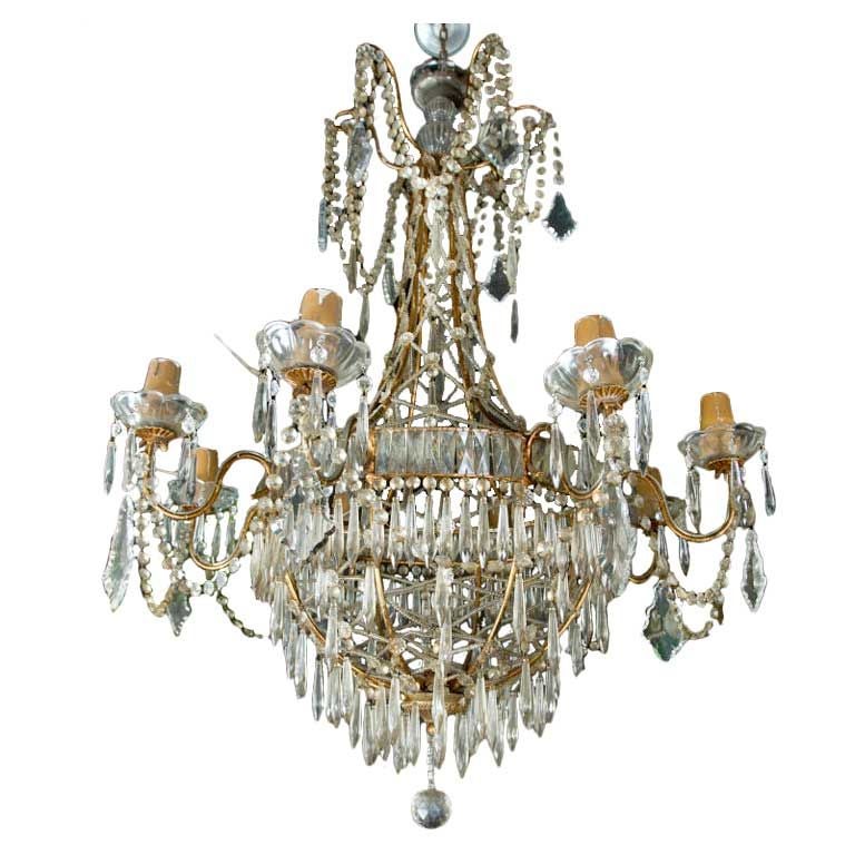 Elegant Neo-Classical style gilt metal and glass eight light chandelier.