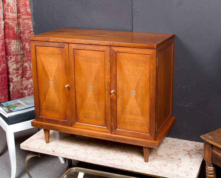 Pair of small teak two door cabinets decorated with pewter inlay.