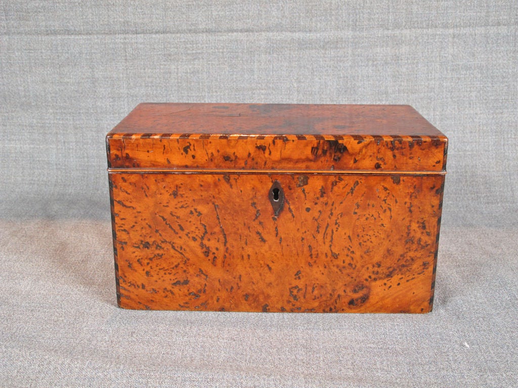 19th Century English beautifully figured burl walnut tea caddy, the interior fitted with three lead lined compartments for tea.