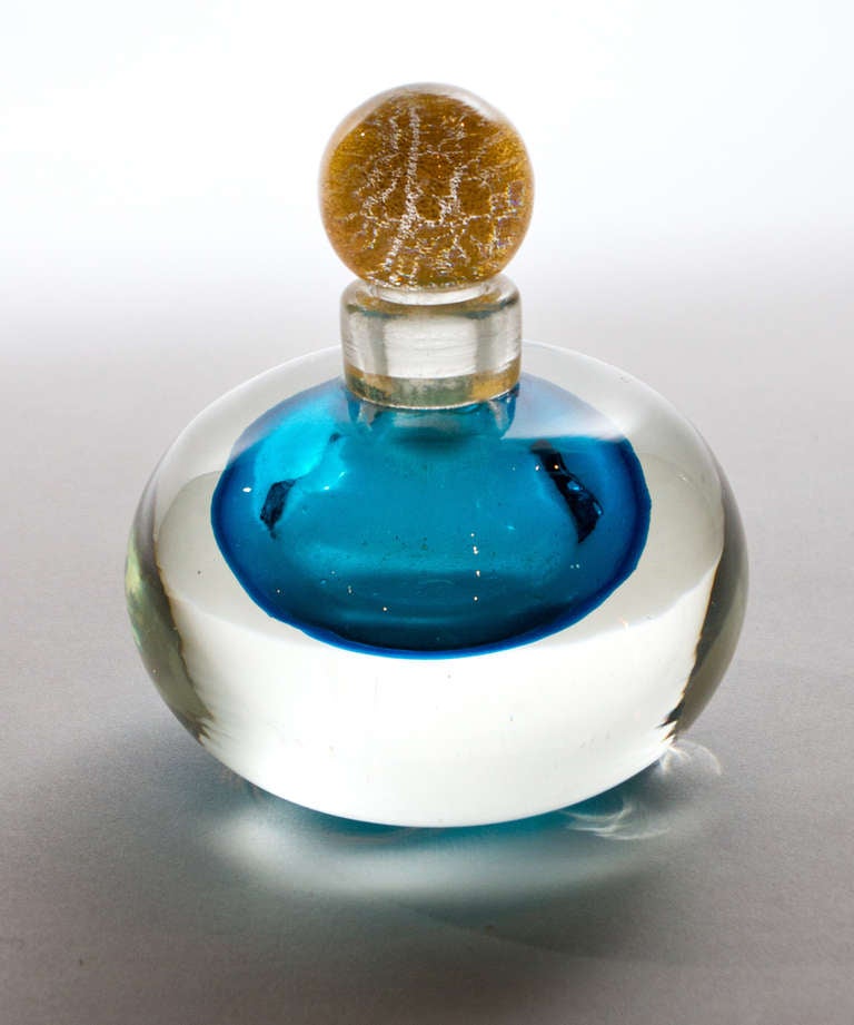 Italian sommerso blue and clear Murano glass perfume bottle with gold speckled stopper.