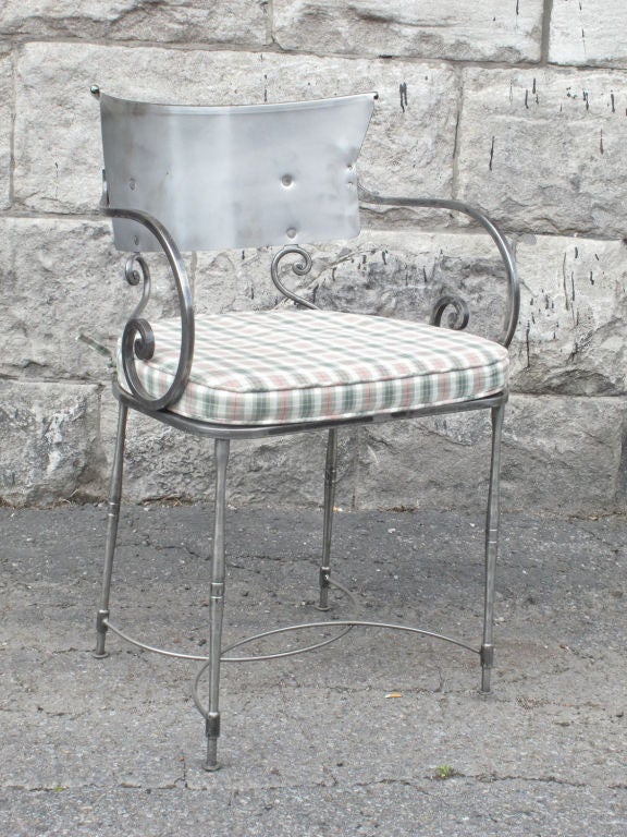 Set of four polished steel neoclassical style armchairs. Stamped: Italy.