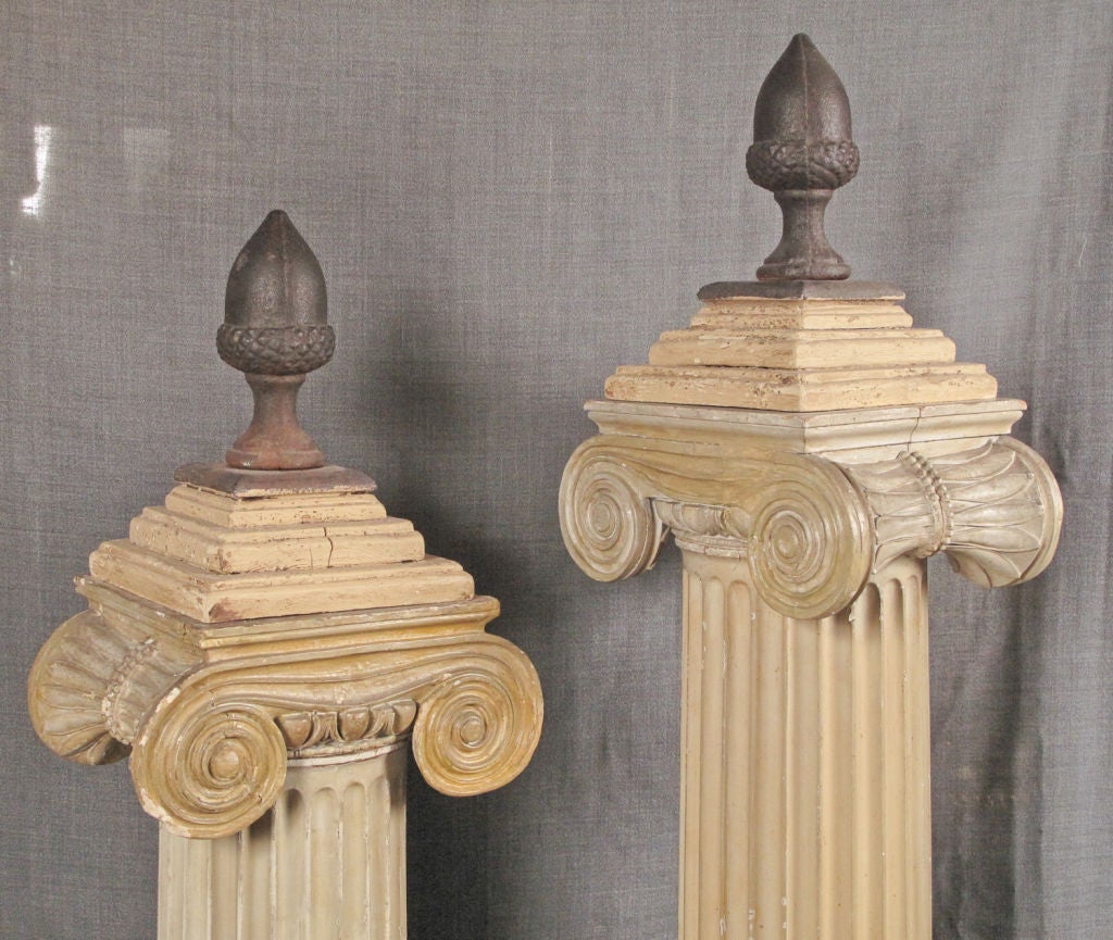 painted wood and plaster Ionic columns mounted with cast iron acorns.