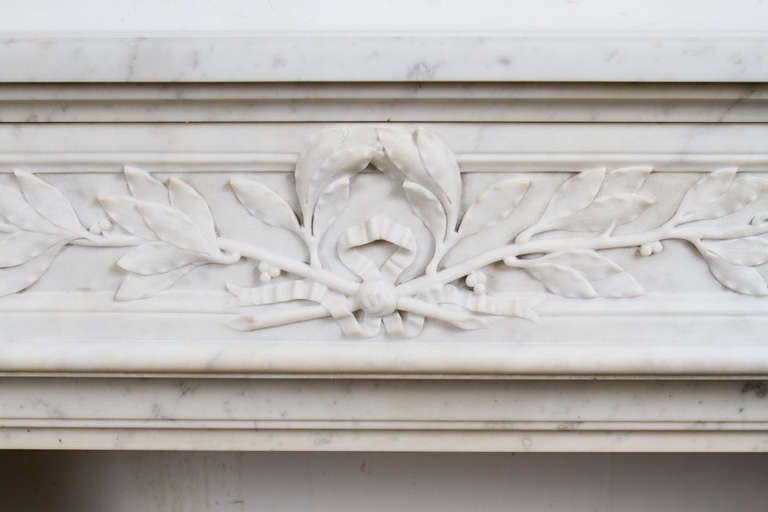 Beautiful white Carrara marble Louis XVI style marble mantel piece. Interior dimensions: W 35