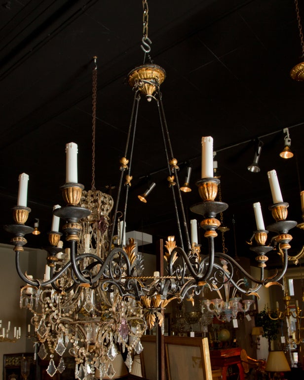  Black painted metal and gilt wood Italian chandelier eight light chandelier.