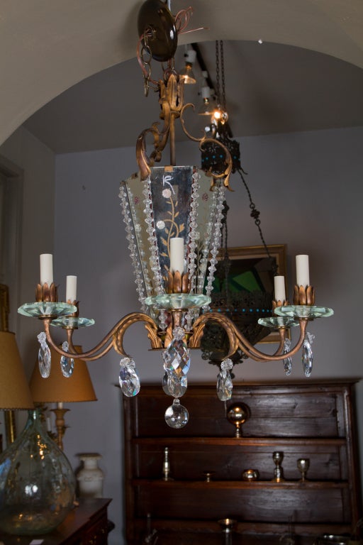 Gilt metal, glass and mirror nineteen forties French six light chandelier. Possibly by Bagues.