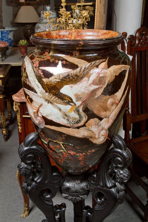 Important glazed ceramic "majolica wear" amphora vase on stand decorated with hand painted birds and foliage, inspired by late 19th century Japonesque style. The amphora is hand signed by the artist: E. Sreteep, the inside of the rim is