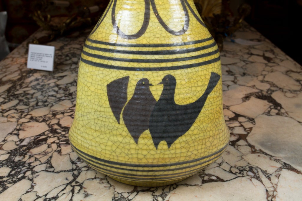 Yellow Italian ceramic lamp with bird decorations.