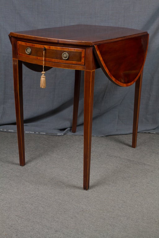 George III mahogany Pembroke table with satinwood cross binding.