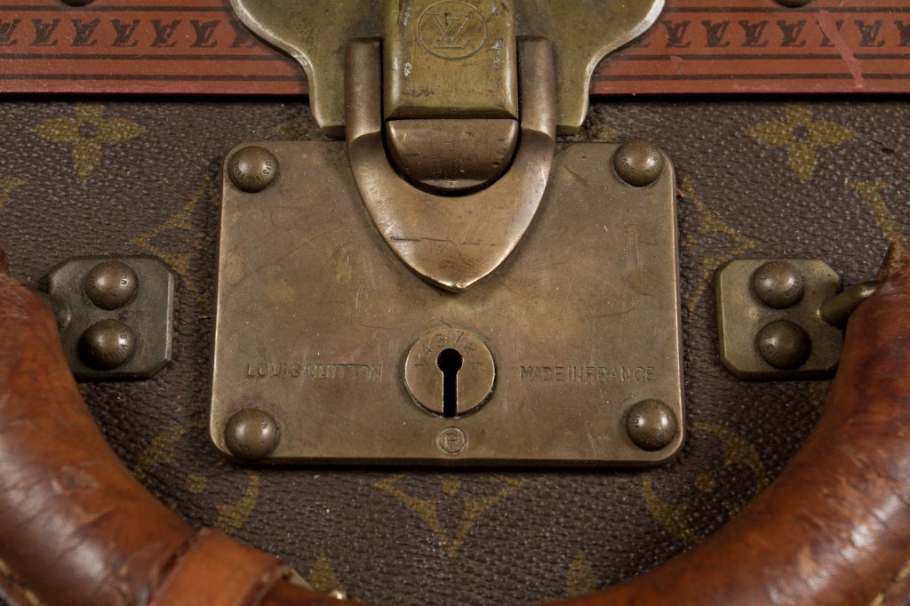 Leather Vintage Vuitton suitcase.