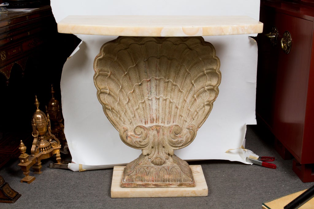 High quality patinated cast plaster shell design console table with thick beige onyx top and base bu Grosfeld House.