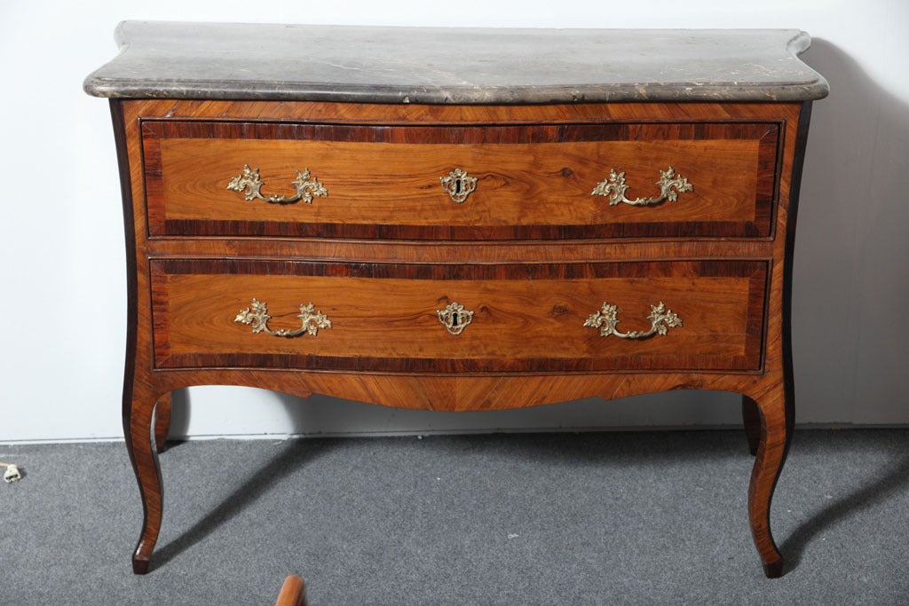 18th Century Italian marble top chest of drawers and fire gilt hardware.
