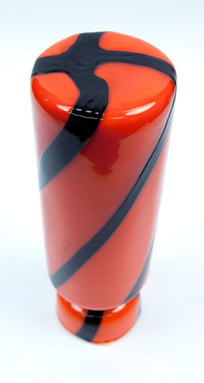 Beautiful and striking modernist hand blown orange Murano art glass vase embellished by applied deep purple geometric lines glass coulees, circa 1960s; approximately 13.5 inches high x 4 inch diameter. A must have to add to your collection or