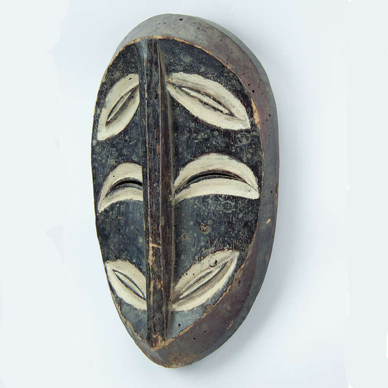 A 20th century mask from the Lega. The Lega people live near the northern end of Lake Tanganyika on the banks of the Lualaba River in the DRC. They are also known as the Warega. Living in small village groups, they have no centralized authority, but