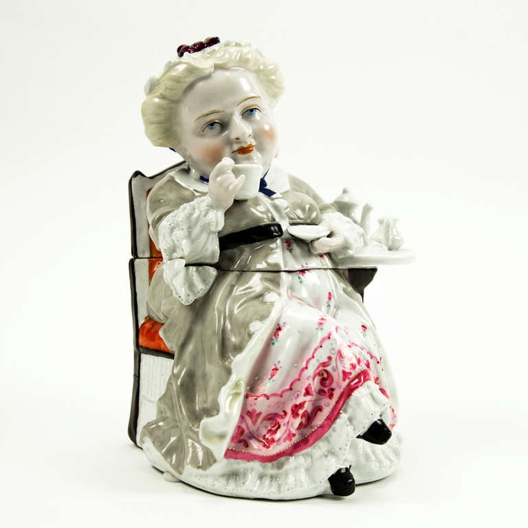 Unique and Whimsical Victorian hand-painted fine glazed porcelain tea caddy or tobacco box with detachable lid, depicting tea time; impressed # on base: 2563 4; France, 19th century.