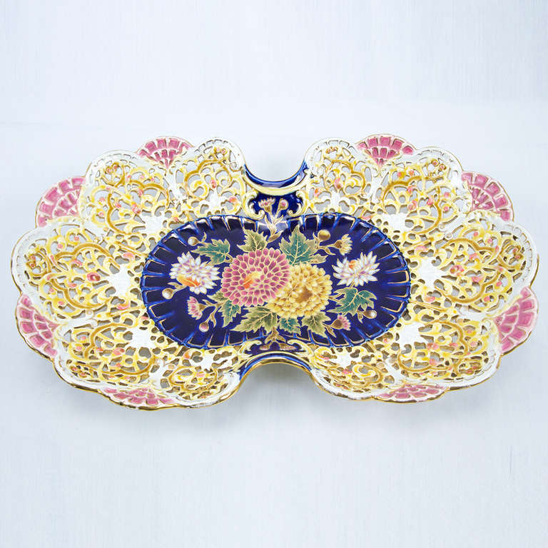 Unique Zsolnay glazed porcelain reticulated platter; an exquisite piece featuring floral and fan motifs with the five church steeples, including impressed ZSOLNAY PECS mark and number 3851 on the bottom; circa 1878-1898. Hungarian origin.