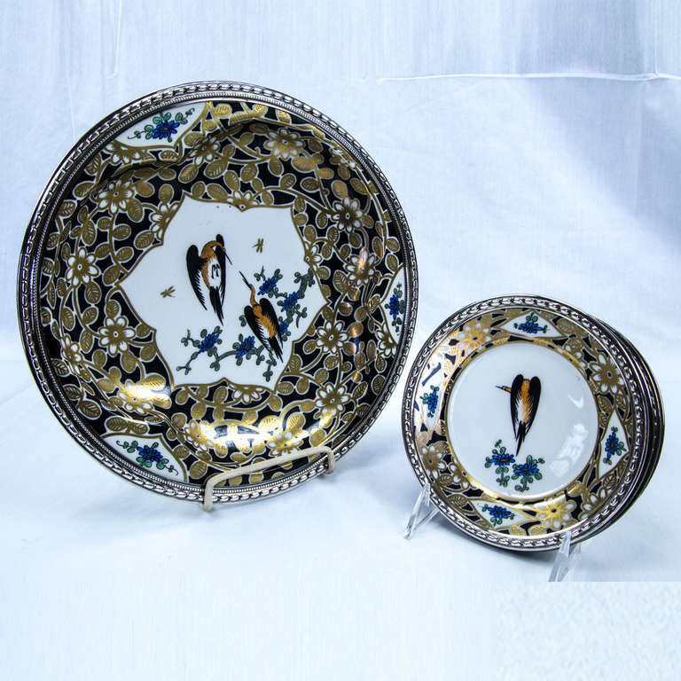 French Samson Oriental style porcelain serving dish with with tri-lobed well, finely hand-painted with gold blossoms on black ground  inter-spaced with flowers over white porcelain; the center depicting a pair of Herons on blue blossom branch, and