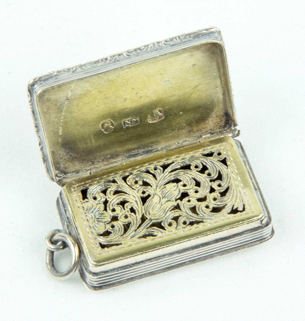 Simply Exquisite! Vintage Georgian Heirloom Sterling Silver vinaigrette by Nathaniel Mills shaped rectangular form, the lid and base finely engraved; top has a central initialed cartouche and applied raised foliate scroll border, the sides with