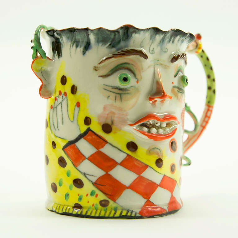 Whimsical and delightful figural porcelain mug; Folk Art piece. Beautifully handcrafted and painted. Signed by renowned Artist: I. Zaytceva, measures approximately 4.5" high x 4” wide.
Irina Zaytceva was born in Moscow, Russia. She graduated