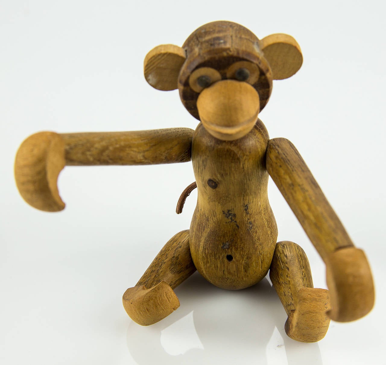 Enchanting and expressive Danish children’s toy is of a fully articulated long armed monkey, beautifully crafted in teak and limba, measuring approximately: 4” high x 4” wide x 3.5” deep, circa 1960s. With life like personality and attitude to