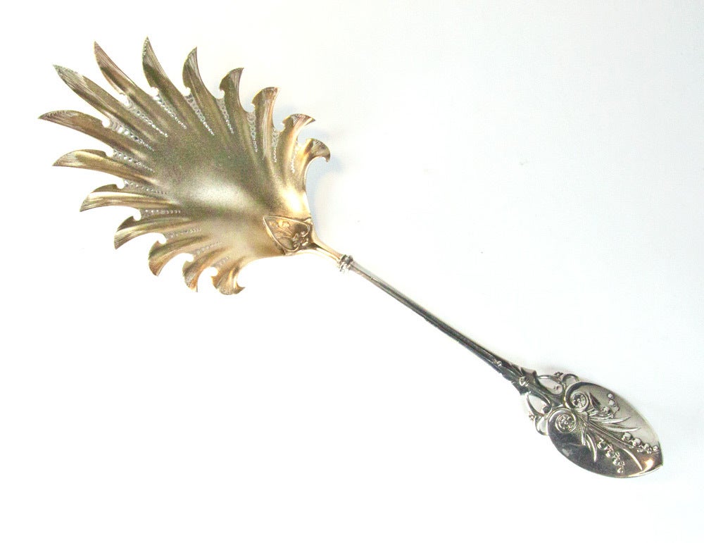 Antique Gorham Lily of the Valley Sterling Silver Pasta or Macaroni Server
An exceptionally beautiful design shows to full advantage. It has a large, fluted scalloped with sharp tines gilt bowl. The back of handle is plain with stampings of the