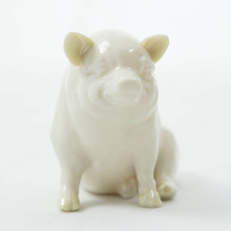 Whimsical porcelain pig made by the Belleek Pottery Ltd. of Ireland; green mark at base corresponds to 1955-1965. Approximate size: 3.5" long x 3.5" high.