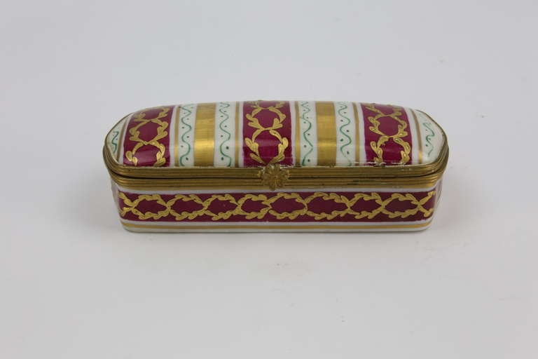 LE TALLEC PARIS FRANCE LIMOGES porcelain trinket box;  hand painted and applied gilding;  It has .The hinged mount is  bronze with flower clasp. Signed on the bottom: LE TALLEC PARIS FRANCE LIMOGES with decorator's initials; measures approx. 4