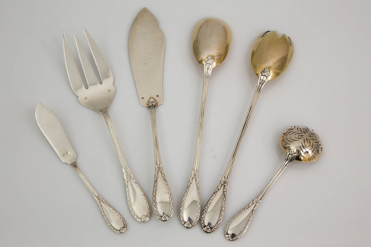 Magnificent sterling silver flatware by Internationally known French Silversmith Lapparra, Classic Louis XVI pattern comprising:
One butter spreader; approximately length: 6.5”.
Fish fork and knife; approximately length: 9” (fork) and 10”