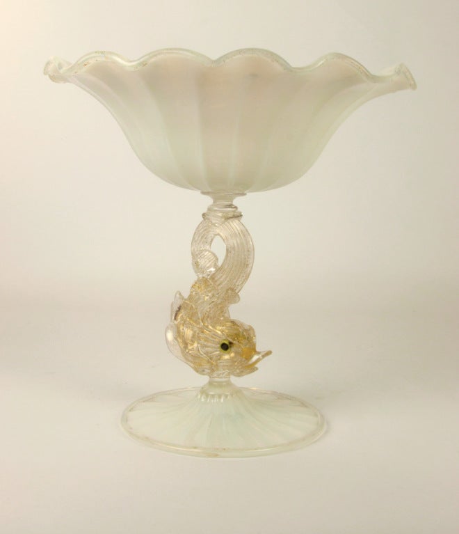 Salviati Murano glass opalescent compote with ruffled border raised on gold flecked  stem modeled as a dolphin with murrine glass eyes over opalescent glass foot.