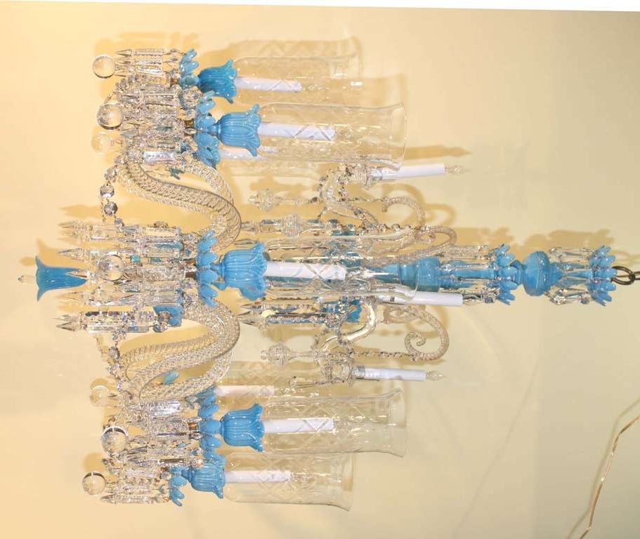 Classic Baccarat twelve-light chandelier with blue opaline body issuing twelve twisted S-form glass arms, the top row of arms extending form blue dish separated by cane form armatures with hollow spires; the main gallery issuing eight arms with blue