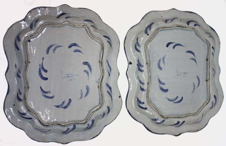 Pair of Savona platters, the serpentine floral borders around the classical scenes. Tower mark on reverse; two hanging holes.