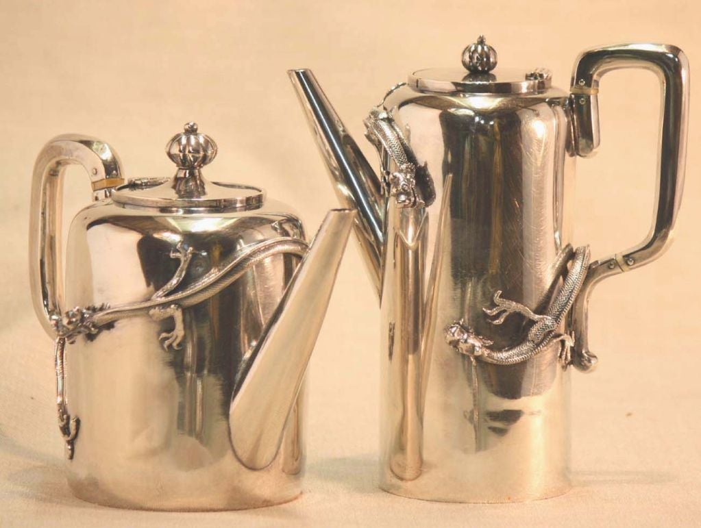 Chinese export silver four piece dragon cylinder shape tea set comprising coffee pot(7