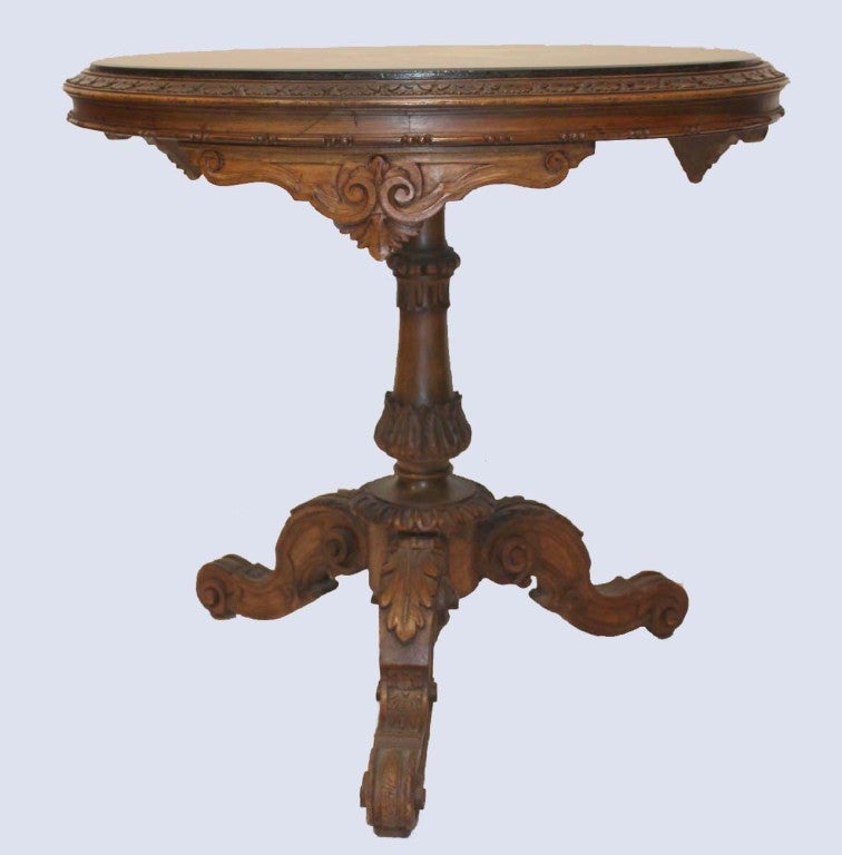Beech wood carved tripod base center table with inlaid pietra dura and scagliola grapes and vines inlaid on black circular marble top.