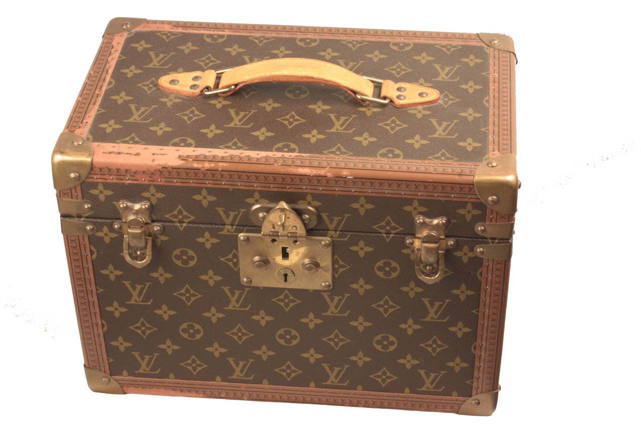 A vintage Louis Vuitton ladies toilet case with original fitted interior for flasks and cosmetics (one box lacking). In excellent condition for its age but with slight rubbing to the inked decoration on the leather edging bands.