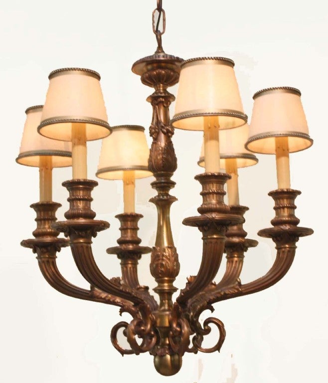 Napoleon III style bronze chandelier modelled with six reeded arms with a double baluster stem, and ball finial.
While not large, this fixture is very heavy.. It might particularly  suit a hall.