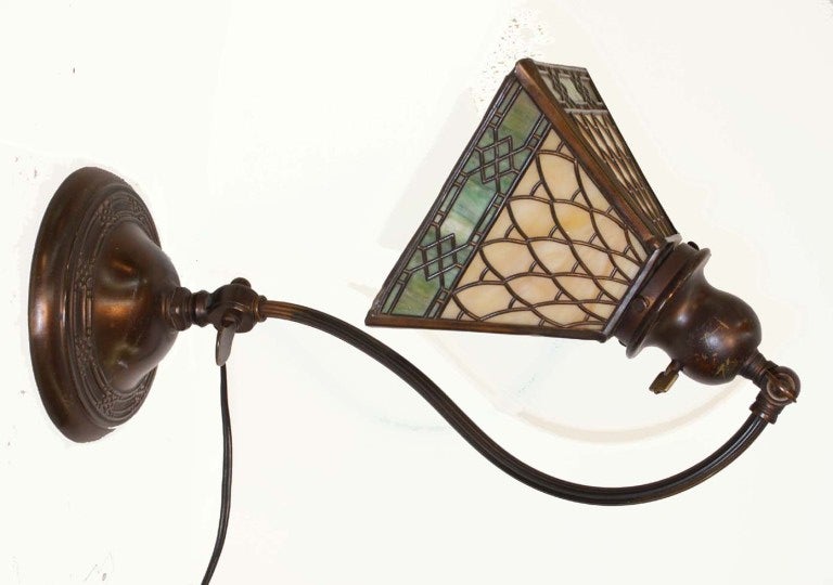 Handel adjustable base table lamp with four sided overlaid slag glass shade, the shade signed Handel.
