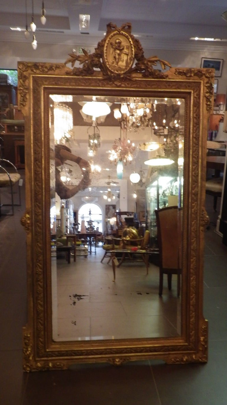 1850s French Gilded Mirror with Cherub Medallion.
