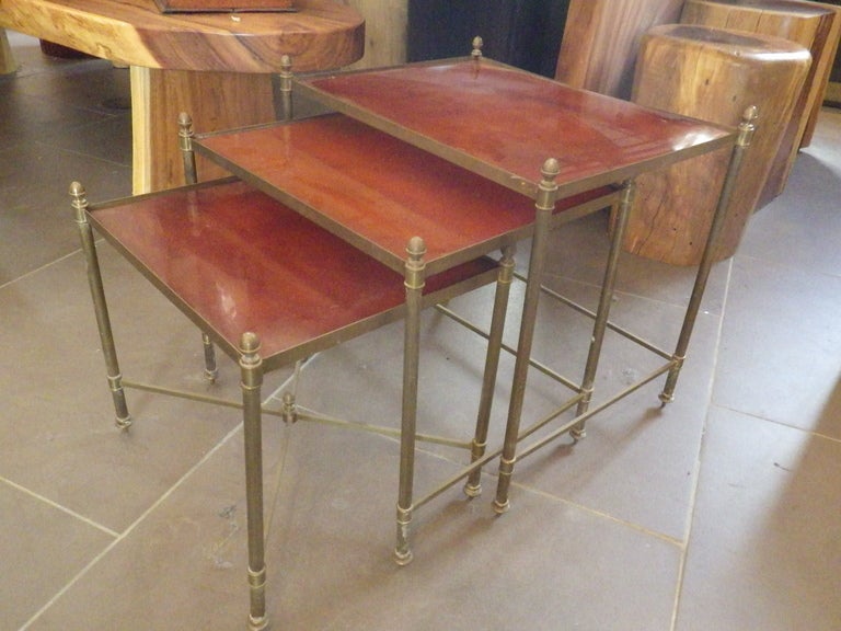 Very elegant set of Maison Jensen nesting tables. 
Brass frame with 