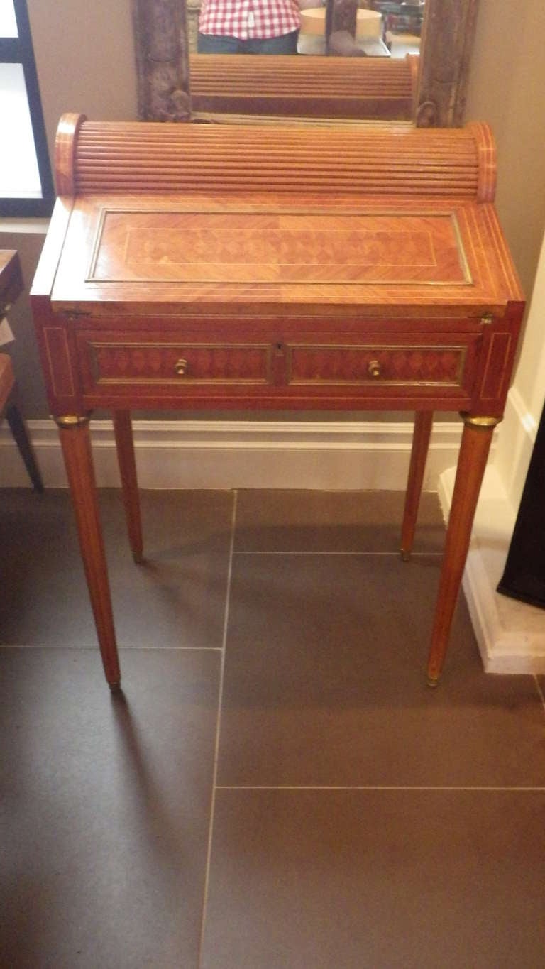 Beautiful Louis XVI style desk with roll-top and skeleton key drawer. Brass inlay throughout.