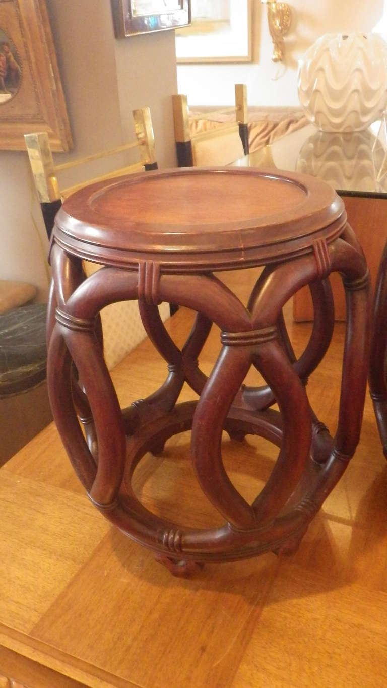 Beautifully crafted pair of stools by John Stuart. Walnut finish with overlapping oval design.