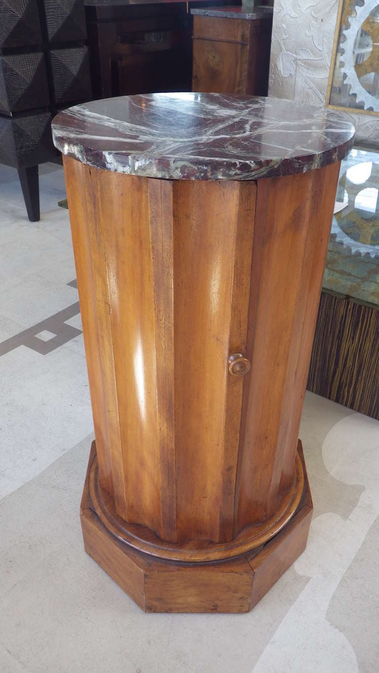 Elegant pedestal base with marble top and swing door. One inner shelf.
Walnut finish throughout.