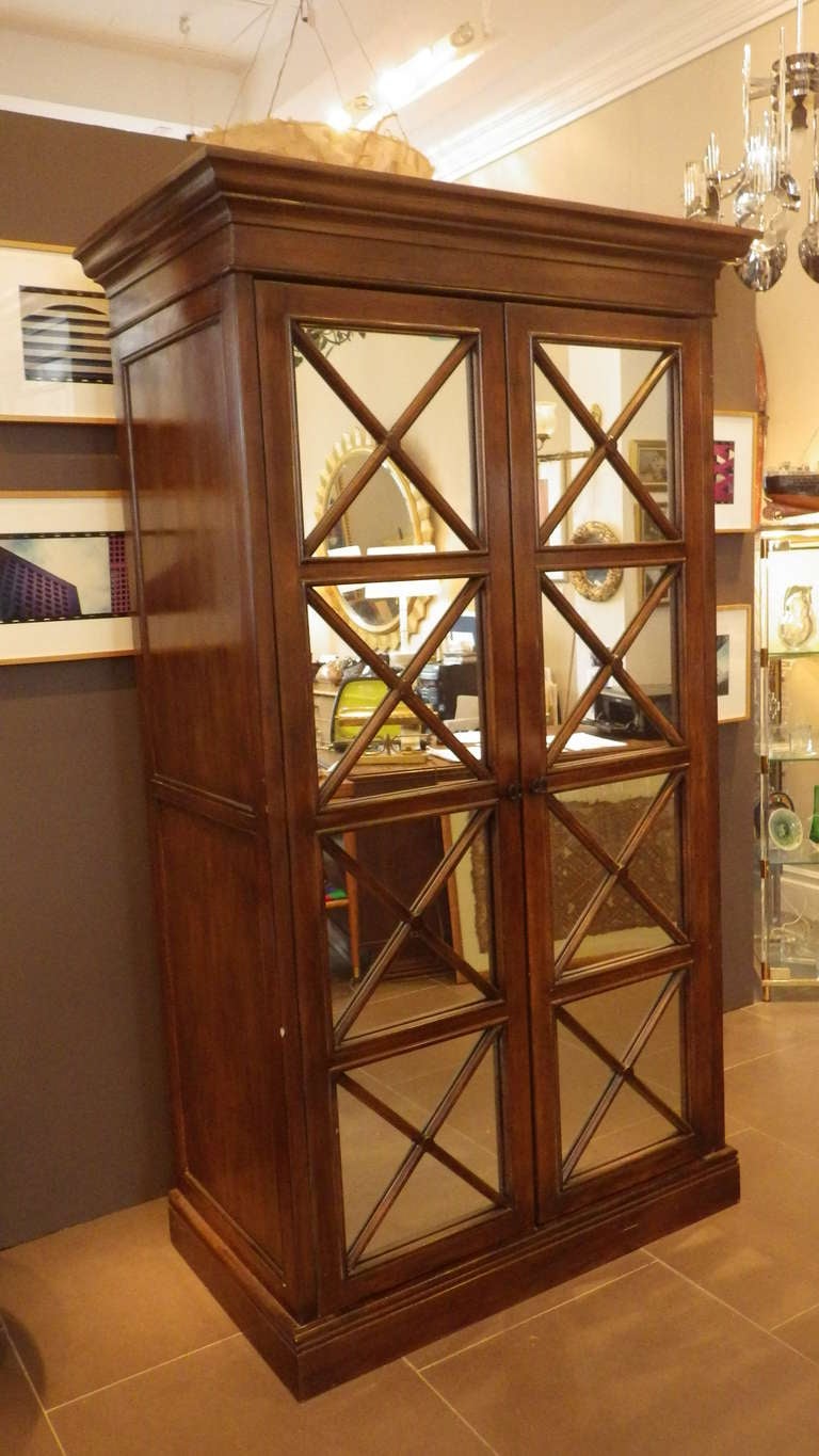 Beautiful pair of armoires from the Beverly Hills Hotel. double doors have mirrored inlay with 