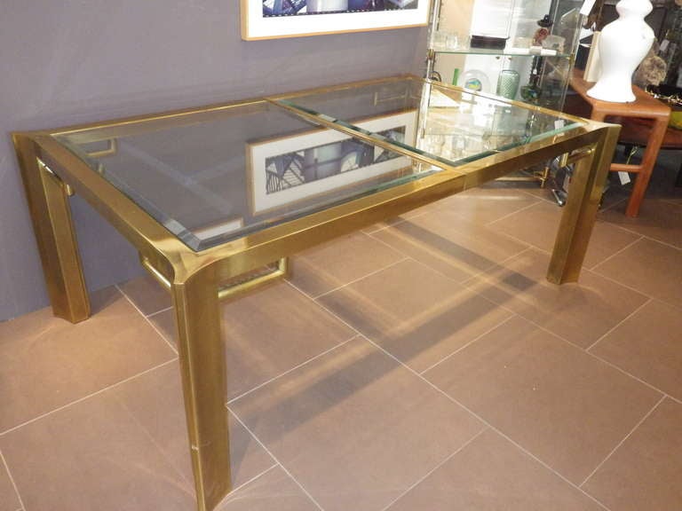 Here we have a beautiful brass table by Mastercraft with a brass frame and a glass top. Warped corners/legs.