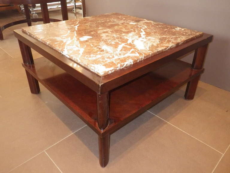 Beautiful, two-level coffee table designed by Stuart Clingman and produced by John Widdicomb. Features a second level halfway to the floor and a marble top.