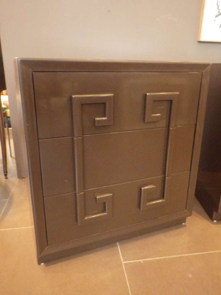 Stylish pair of cabinets by Kittinger. Cabinets feature a chocolate matte-brown finish.